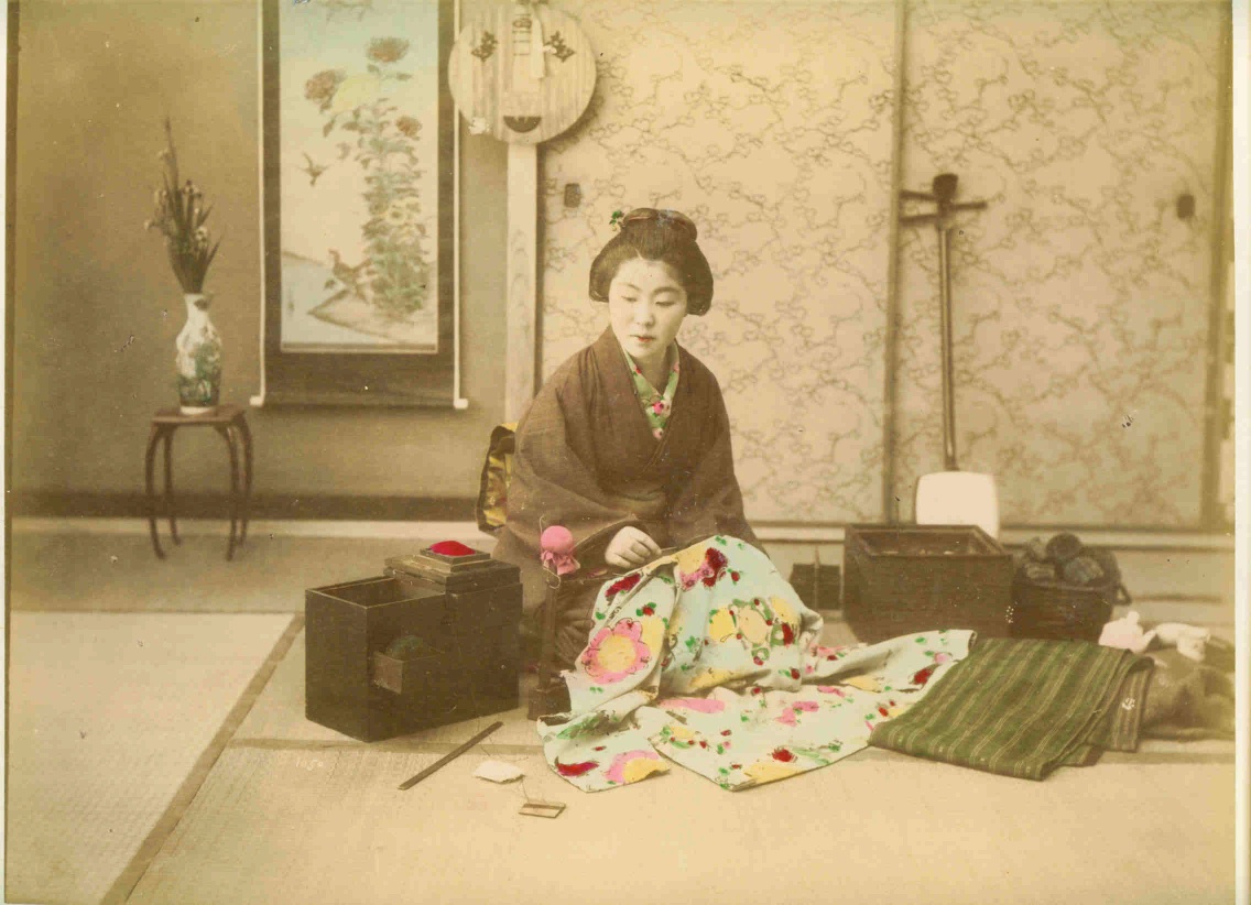 Woman sewing Albumen